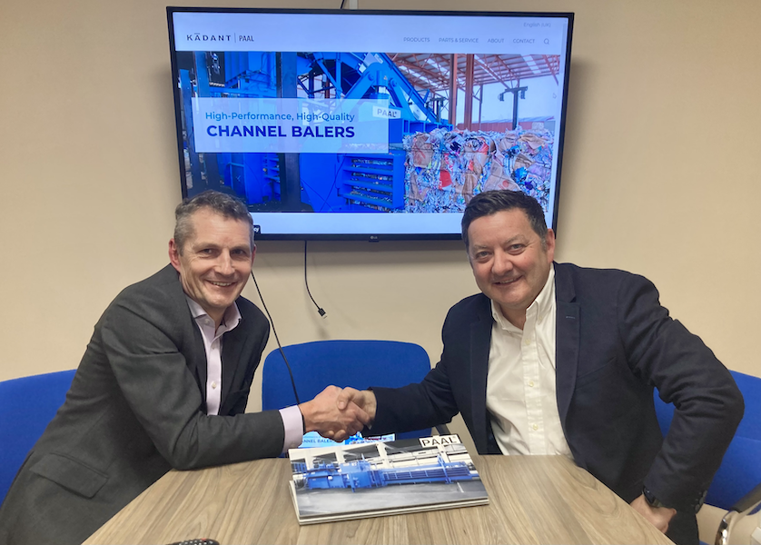 Craig Heley and John Cummins shake hands to solidify the partnership between Kadant PAAL and LSM Ireland, regarding the Kadant PAAL automatic balers range