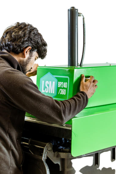 User managing two-handed Bin Press controls