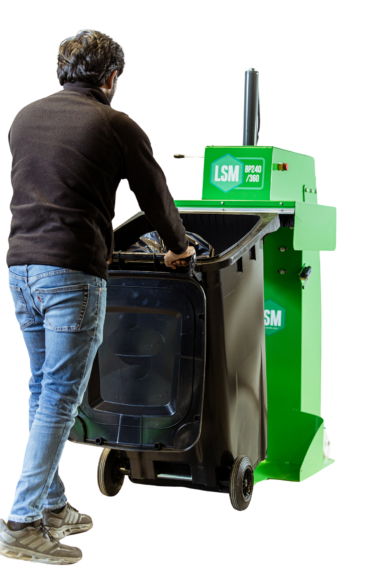 User moving bin into bin press for waste compaction